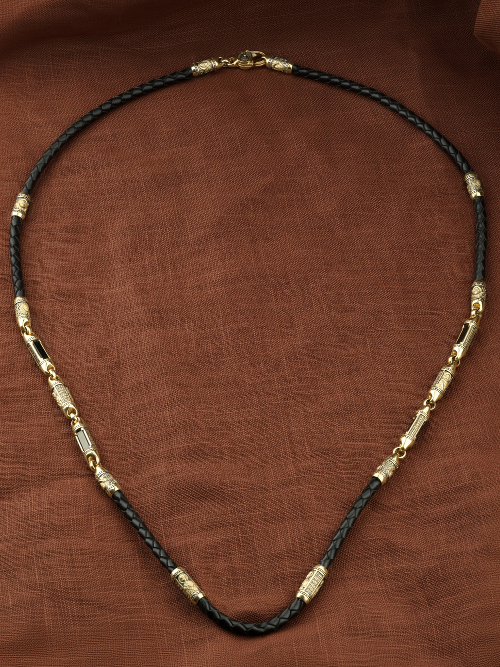 Гайтан из лимонного золота c кожаным шнурком и ониксом